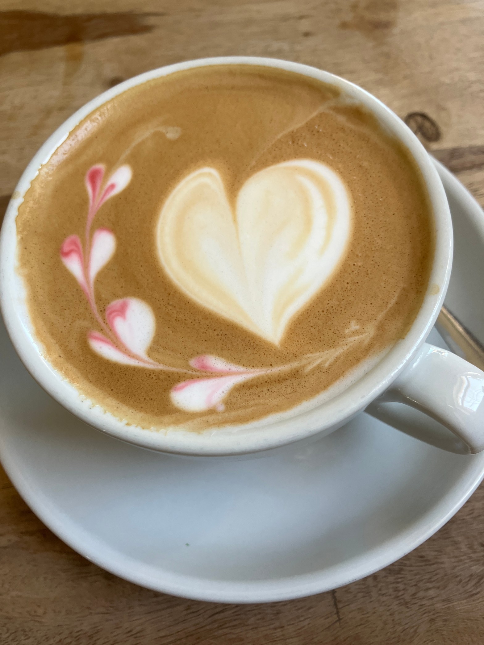Cup of coffee with heart decoration