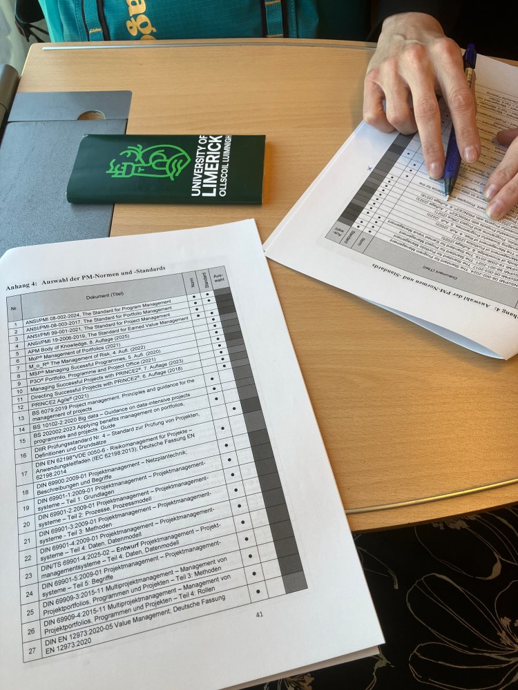 Sheets of printed paper and a bar of chocolate with UL brand